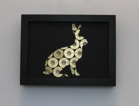 Hase mit Kaliber 12 Hülsen